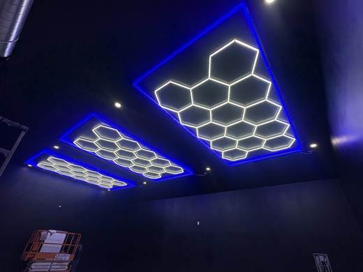 Custom blue-accented hexagon LED ceiling lighting installed by Jefferson's AC & Electrical